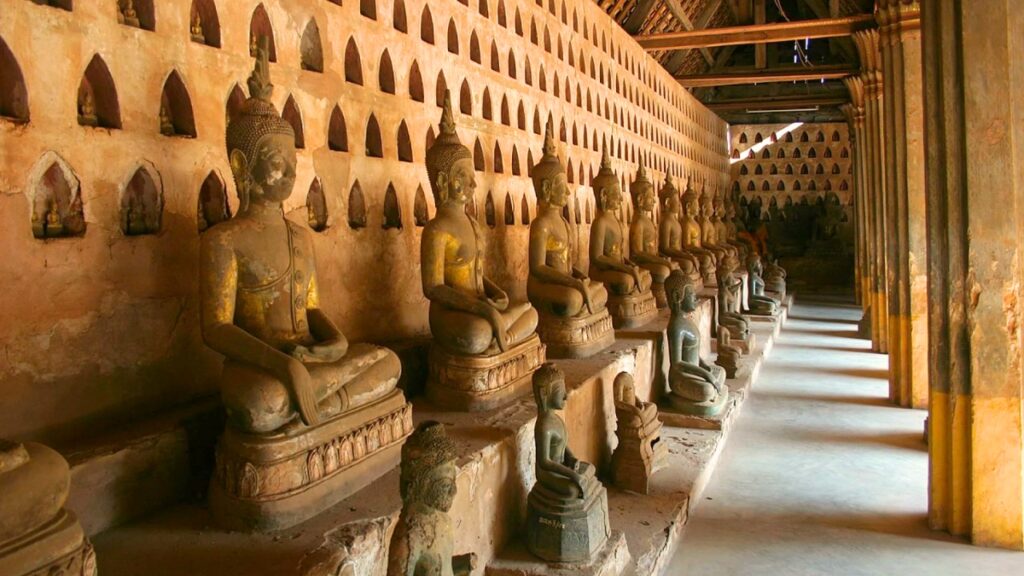 Vientiane, Laos: A Three-Day Pause in the Universe 5 Rows of gold and silver Buddha statues lining the cloister walls of Wat Si Saket temple in Vientiane, Laos